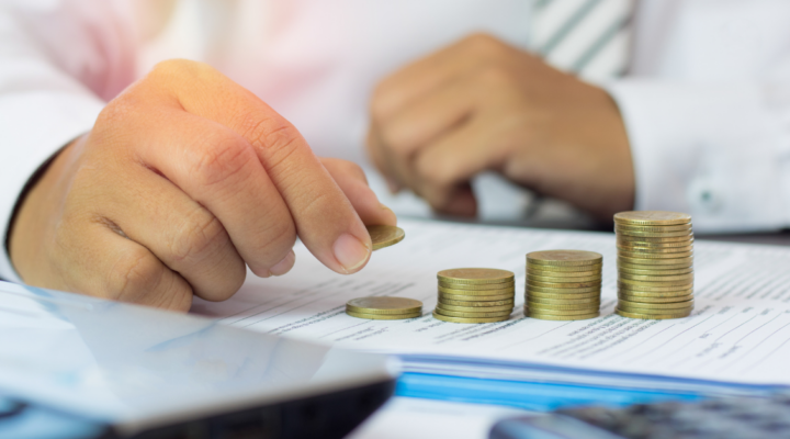 image that shows corporate person counting money in order to reference the capital stack