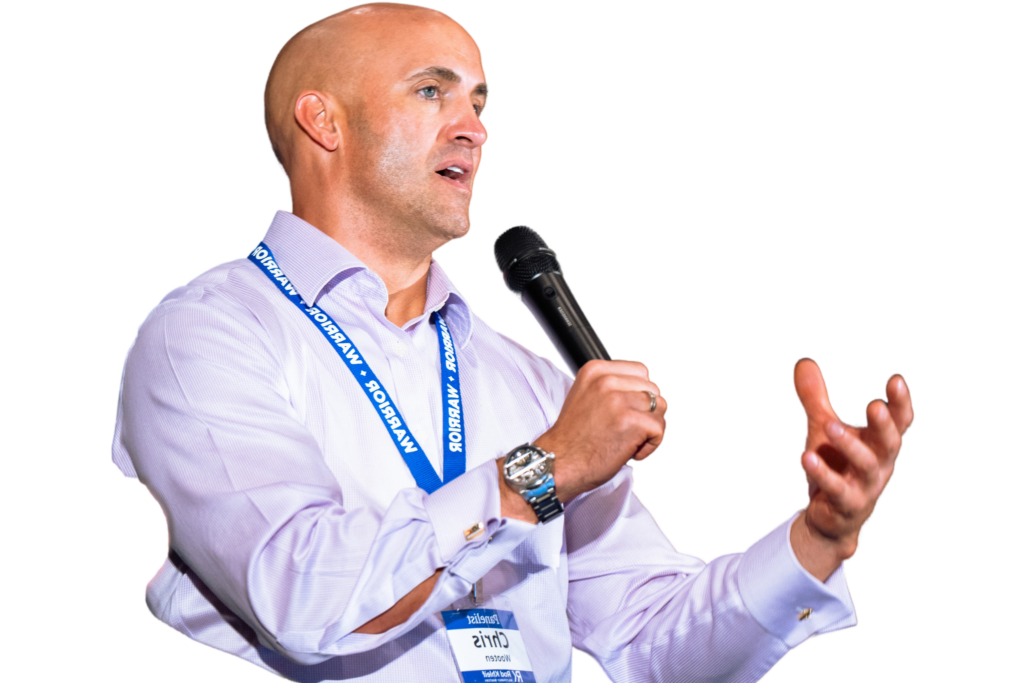 Image of Chris Wooten speaking on stage at Rod Khleif's Multifamily bootcamp