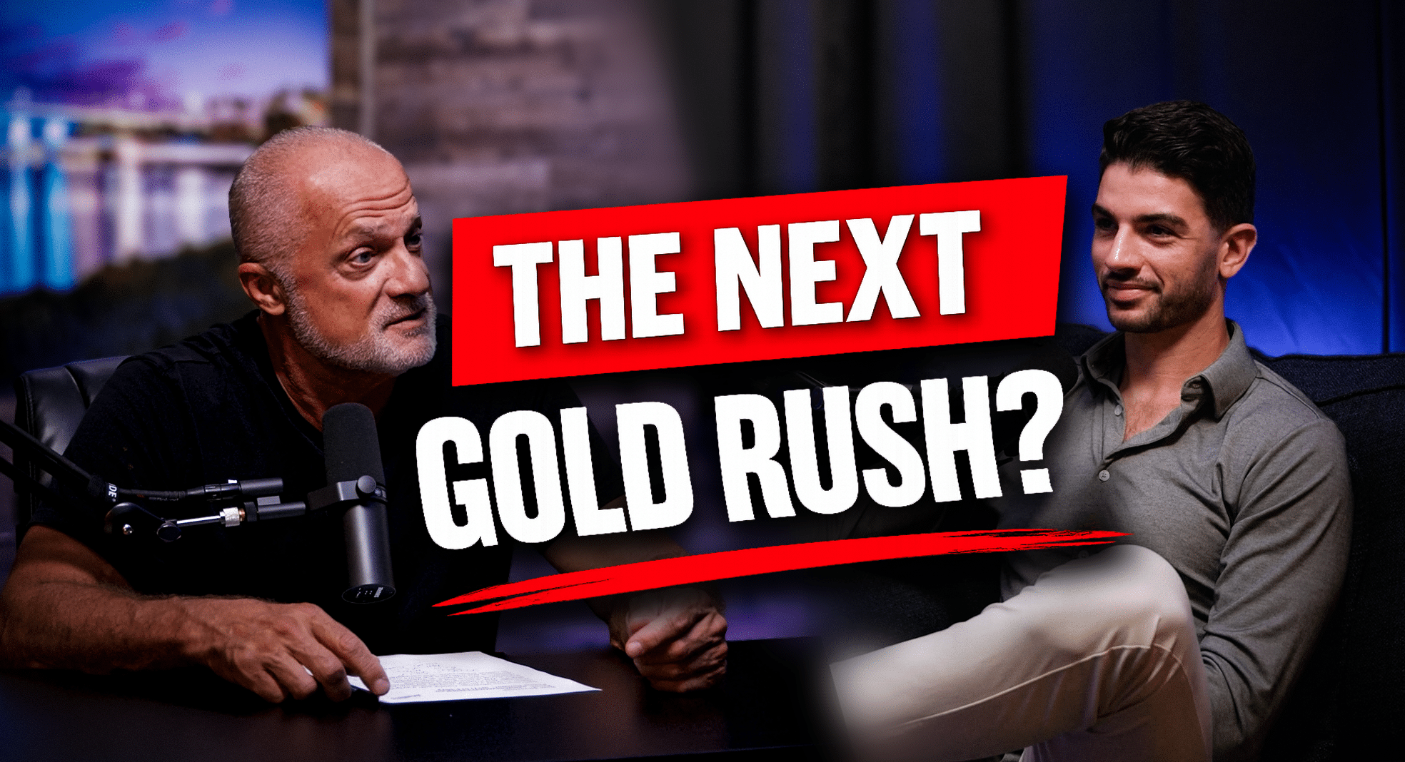 Two men in a podcast studio with a bold red banner reading 'THE NEXT GOLD RUSH?' across the middle, microphones visible on the table.